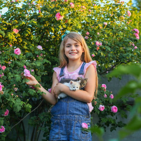 Young girl with two kittens